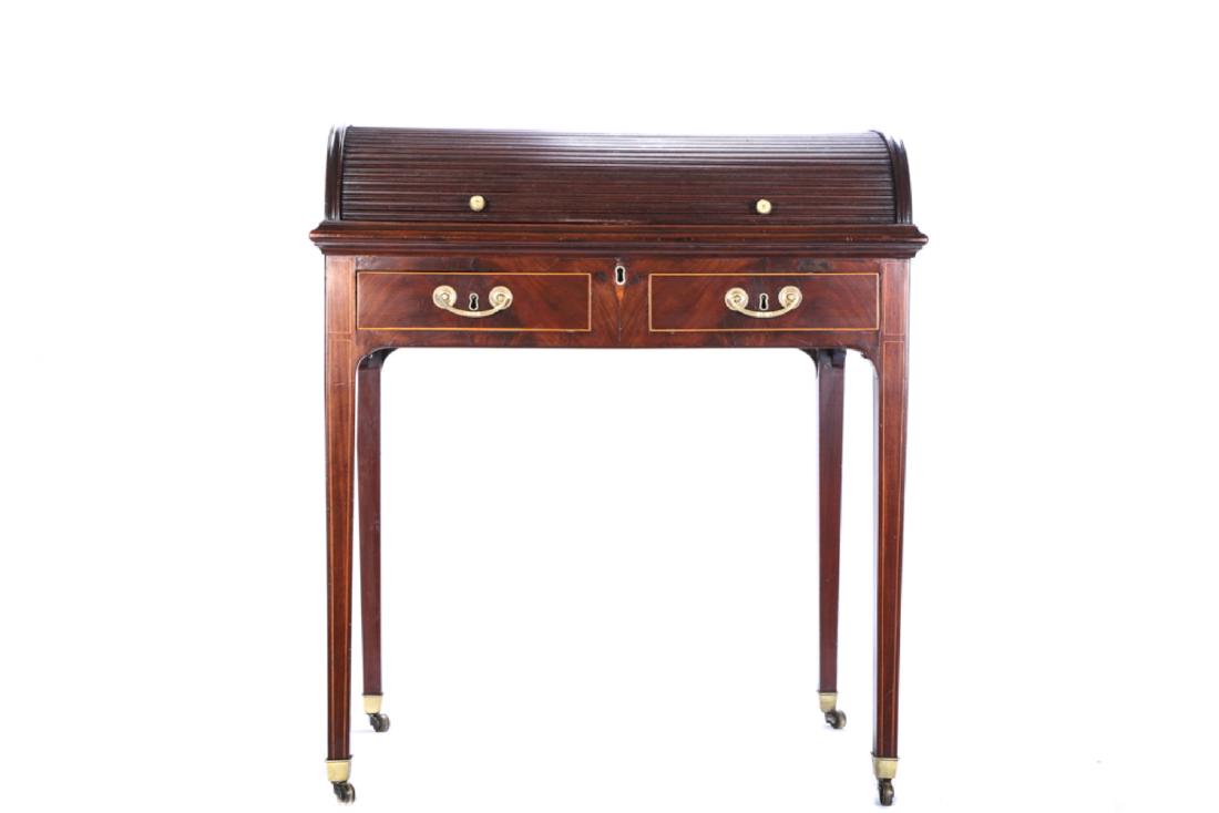 GEORGE III MAHOGANY DOME TOP TAMBOUR WRITING DESK: Rolling curved tambour lid opens a felt writing surface, pigeon holes and (4) small drawers. Frame consists of string inlayed drawers and tapered Hepplewhite legs on brass castors. 36 x 31 x 22 inches