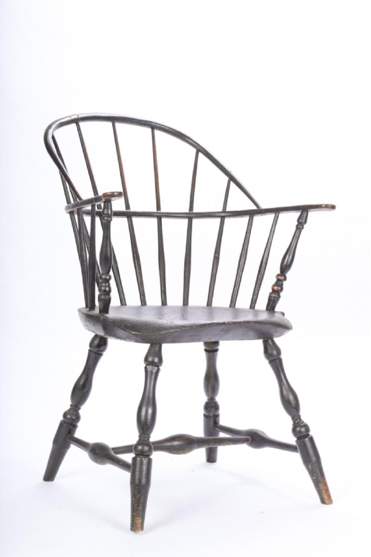 (18th c) WINDSOR ARMCHAIR in GREEN/ BLACK PAINT: Delicately turned armchair with appealing proportions. 34 x 25 x 23 inches.