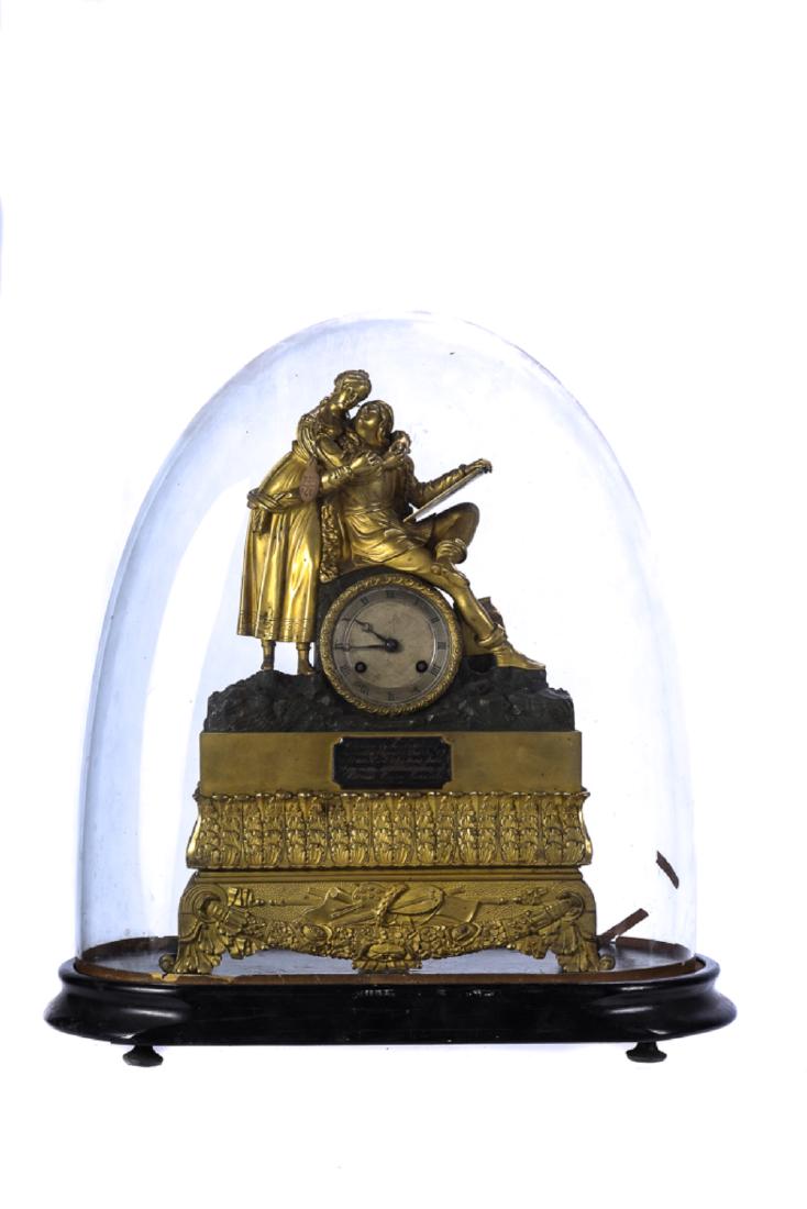 1834 BOSTON FIRE DEPARTMENT PRESENTATION CLOCK: French fire gilt bronze mantle clock with romantic couple sitting on 2 1/4 inch chiming movement raised by a gilt plinth of repeating acanthus leaves on a base with musical instruments and floral swag