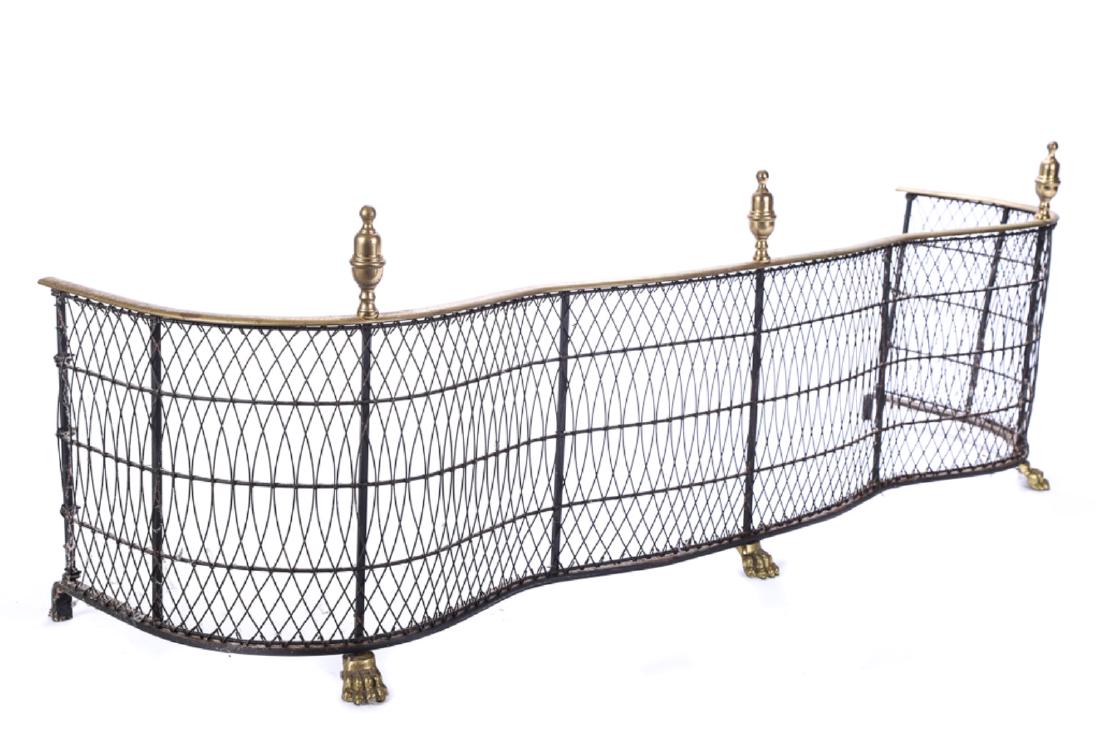 FEDERAL STYLE BRASS & WIRE FIREPLACE FENDER: Serpentine form with urn finials and lion paw feet. 16 x 49 x 15 inches