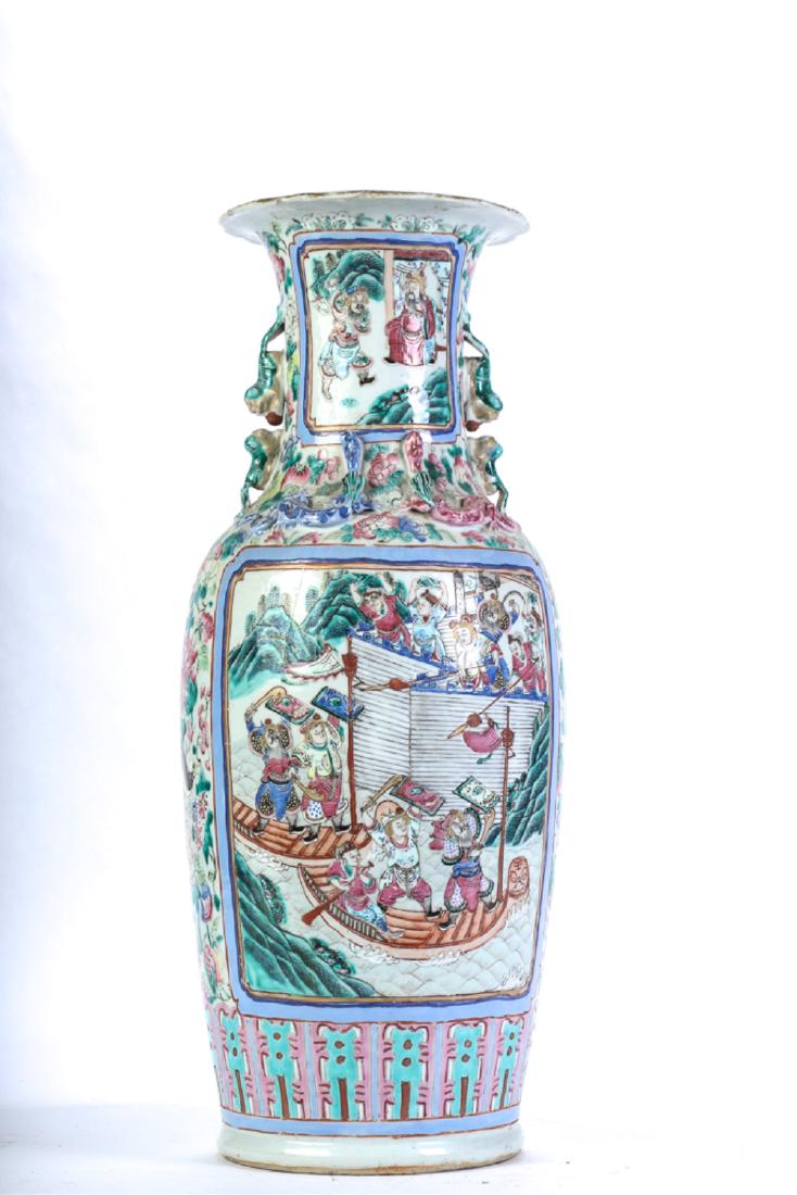 CHINESE FAMILLE ROSE PORCELAIN VASE: Decorated with fish-form handles and chilong along shoulder. Cartouches decorated with court scenes on an all-over floral ground. 24 1/4 inches.