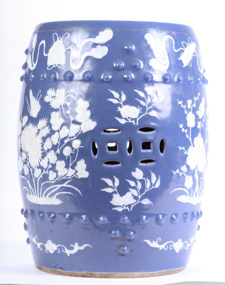 CHINESE PORCELAIN GARDEN SEAT: Covered in raised floral motifs. 18 1/2 x 14 inches.