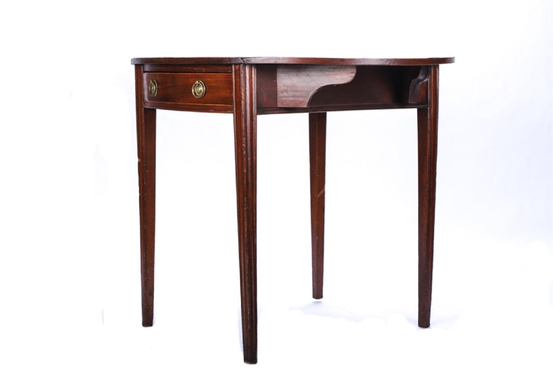 OVAL MAHOGANY DROP LEAF PEMBROKE TABLE: Banded and string inlayed top, bowed ends ((1) with single drawer), molded tapered legs. 28 x 29 x 20 inches (leaves down)