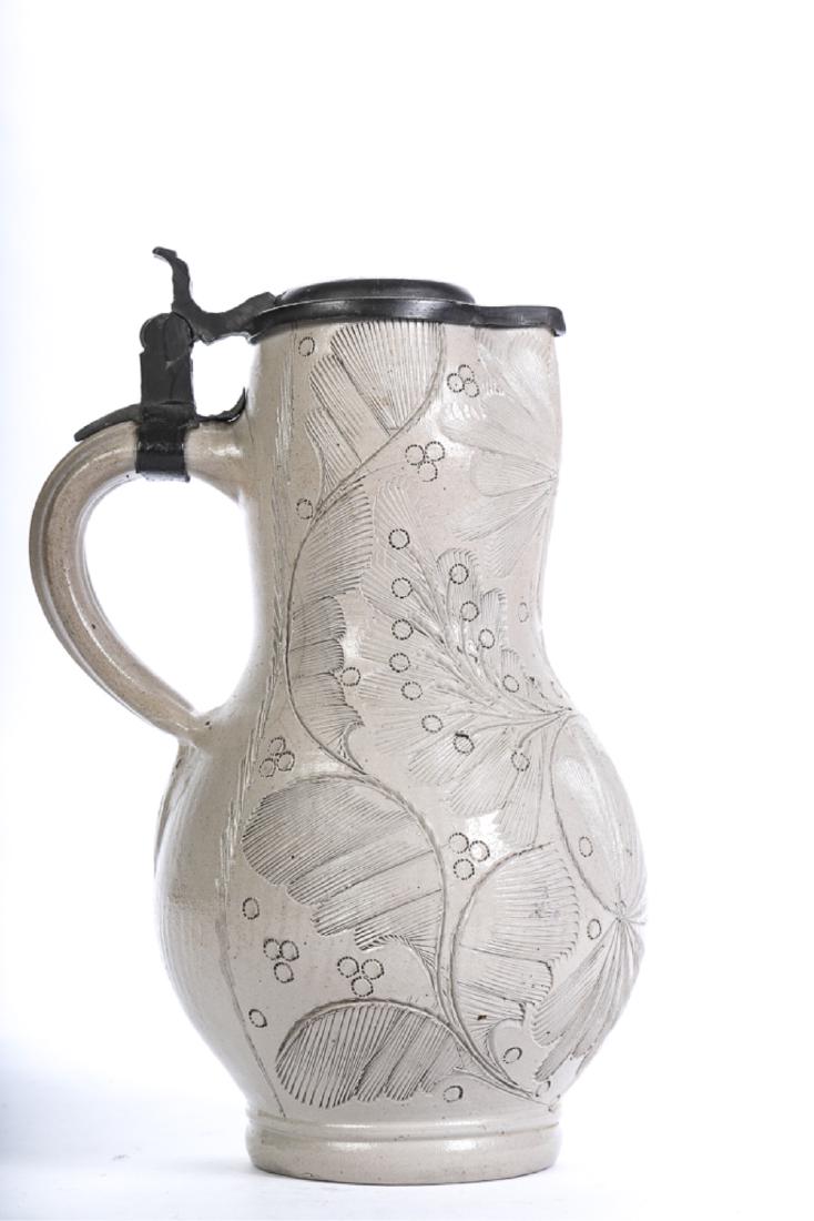 EARLY INCISED SALT GLAZED STONEWARE TANKARD: Elaborate floral motif / possibly Dutch. Pewter cover. 9 inches.