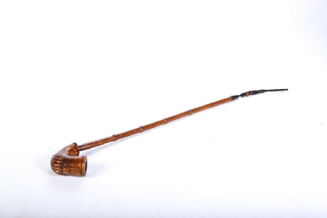 ANTIQUE GERMAN LONG STEM PIPE: Shell-carved burl wood bowl and bamboo turned stem. 39 1/2 inches (overall)