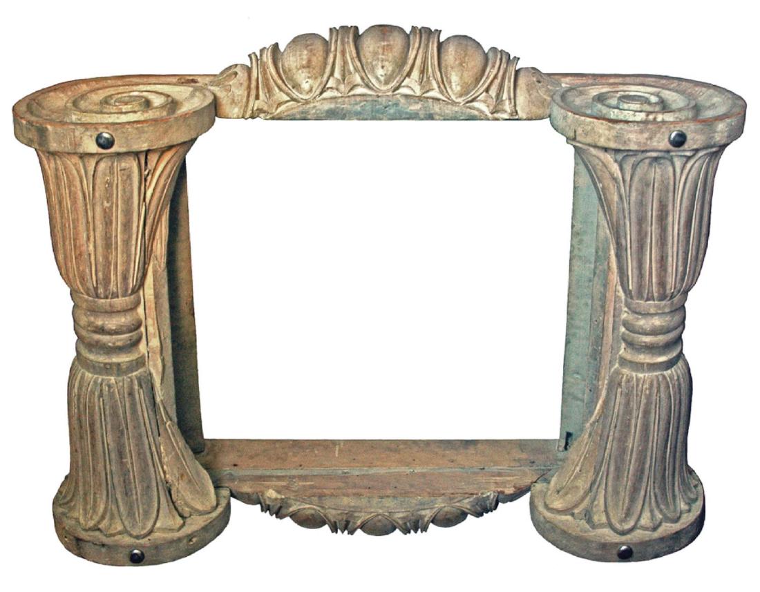 CARVED WOODEN ARCHITECTURAL FRAGMENT: Massive Ionic Capital, C1830-1870. The architectural element was most recently used as a low table base; hung vertically it would make an impressive frame for a large mirror plate. H 52”; W 44”; D