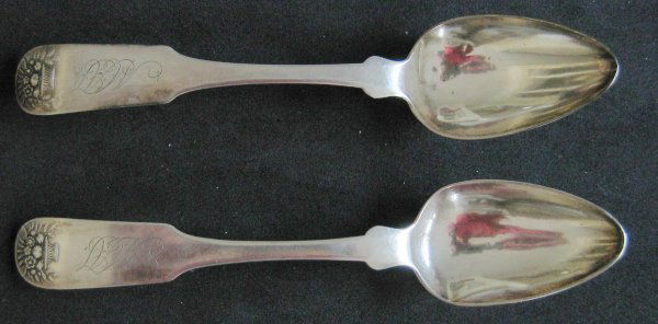 Two coin silver teaspoons: Two coin silver teaspoons, basket-of-flowers design, three script initials "ACT"(?) on the front, with the mark of David B. Nichols, Savannah, Georgia.