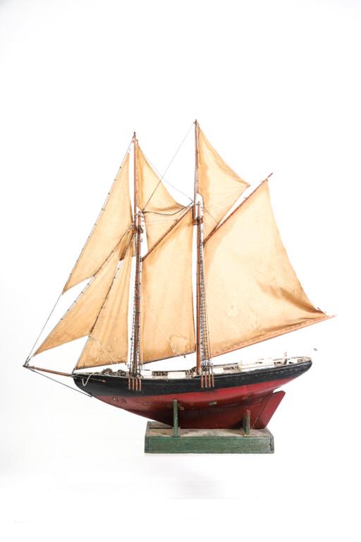 DOUBLE MASTED SCHOONER MODEL: Sailed and rigged, good patinated surface. H 3' 9" L 3' 8". Comes with shipping crate