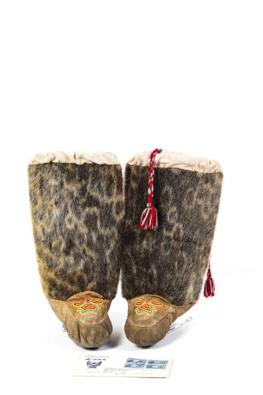 GRENFELL MISSION CHILD'S SEAL FUR / SKIN BOOTS: With colorful vamp beadwork and tassel pulls. 12 x 7 1/2 inches. Together with Grenfell Mission commemorative cover and 1941 block of cancelled Grenfell 1865-1940 Newfoundland 5 cent stamps. Provenanc