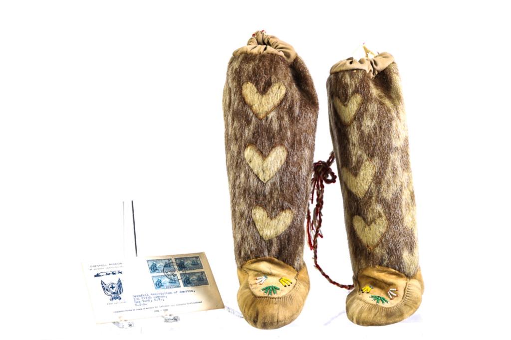 GRENFELL MISSION CHILD'S FUR SEAL SKIN BOOTS: Colorful vamp bead work, applied fur hearts and tassel pulls. 12 x 7 1/2 inches. Together with Grenfell Mission commemorative cover and 1941 block of cancelled Grenfell 1865-1940 Newfoundland 5 cent s