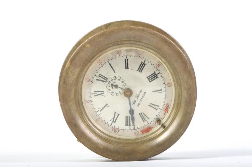 UNUSUAL SETH THOMAS BRASS ALARM CLOCK: With PAT. OCT 19, 09. The glass rotates and has a large red arrow, the inner dial rotates as well with 0 - 60(mins). Side of the clock with "HOUR ALARM with toggle to MINUTE ALARM. Also has another to