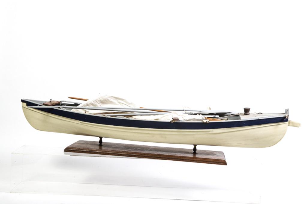 MODEL OF A BEETLE WHALE BOAT.: Includes 5 rowing oars plus the harpooner's steering oar. 2 line tubs, harpoon gun with harpoons, mounted harpoons, lances, hatchet, knife, rudder, sails etc. Model is 60" long. Nicely detailed and in