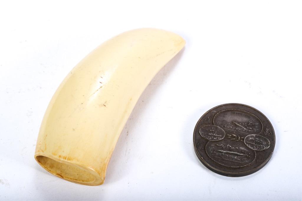 SPRING & SON 1916 MEDAL & FAUX WHALE TOOTH: LOT 1) medal commemorating sinking of naval ships by "SPRINK & SON 1916" - , reverse with listing of ships also listing of enemy ships sunk. 1 3/4" in diameter. 2) plastic tooth.