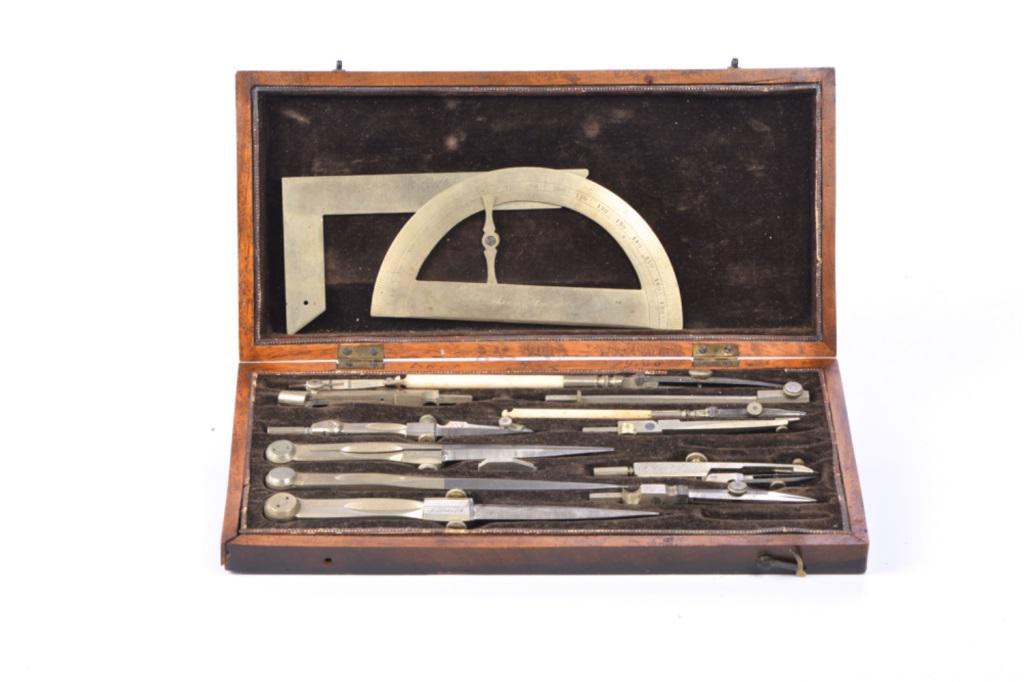 ISAAC SMITH OF BOSTON DRAWING SET: Drawing set made by Isaac Smith (1749-1829) of Boston. All instruments are made of ebony with scales and brass fittings nickel/brass and most are signed ISAAC SMITH. Housed in a mahogany case with pla