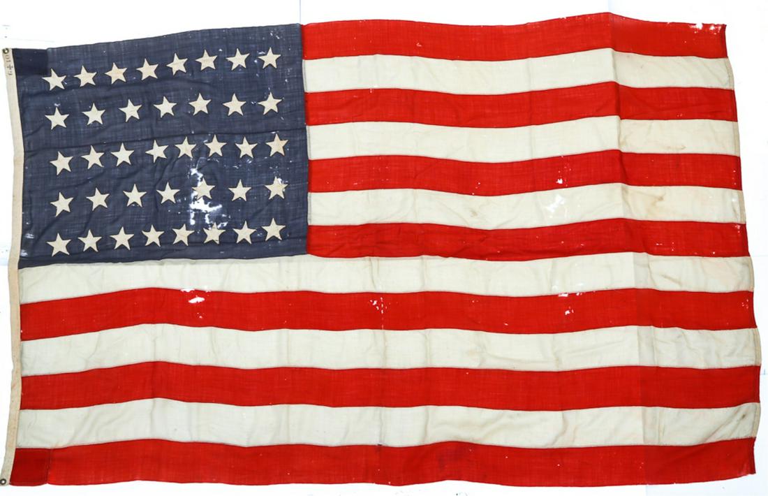 38 STAR AMERICAN FLAG: FLAG, 38 star flag, 65" X 112". Fair condition with holes and tears.