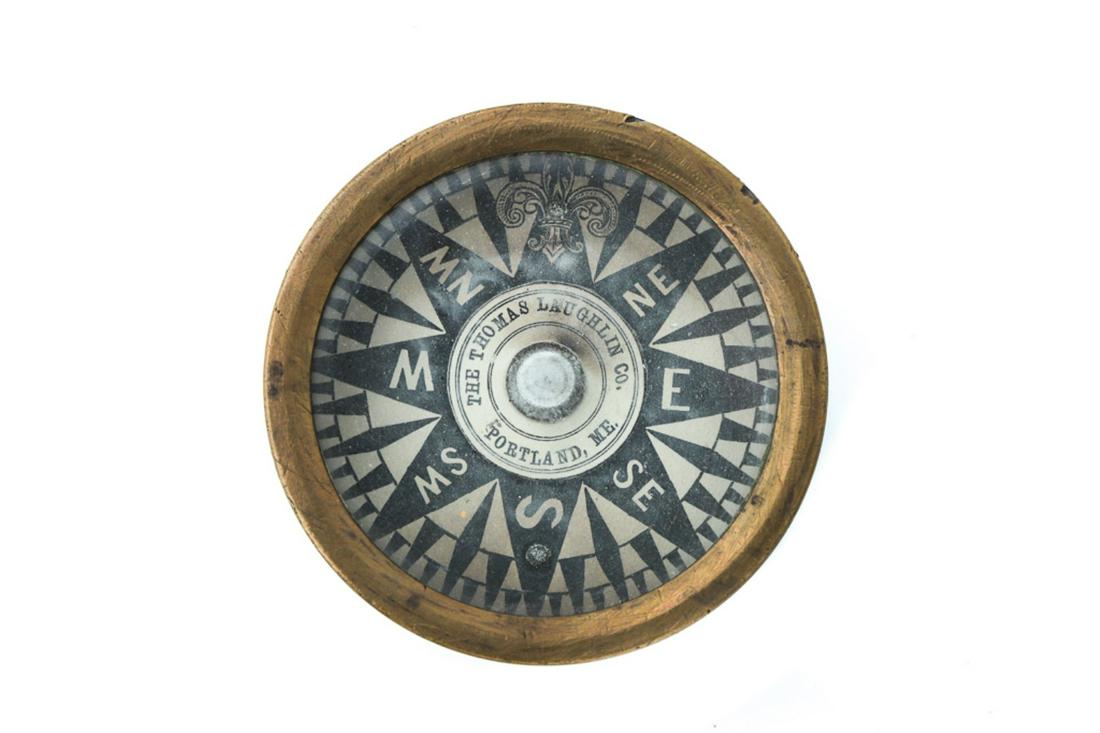 "THE THOMAS LAUGHLIN CO. PORTLAND ME" COMPASS: COMPASS, Portable dry card compass made by "THE THOMAS LAUGHLIN CO. PORTLAND ME". Compass is 3" in diameter.