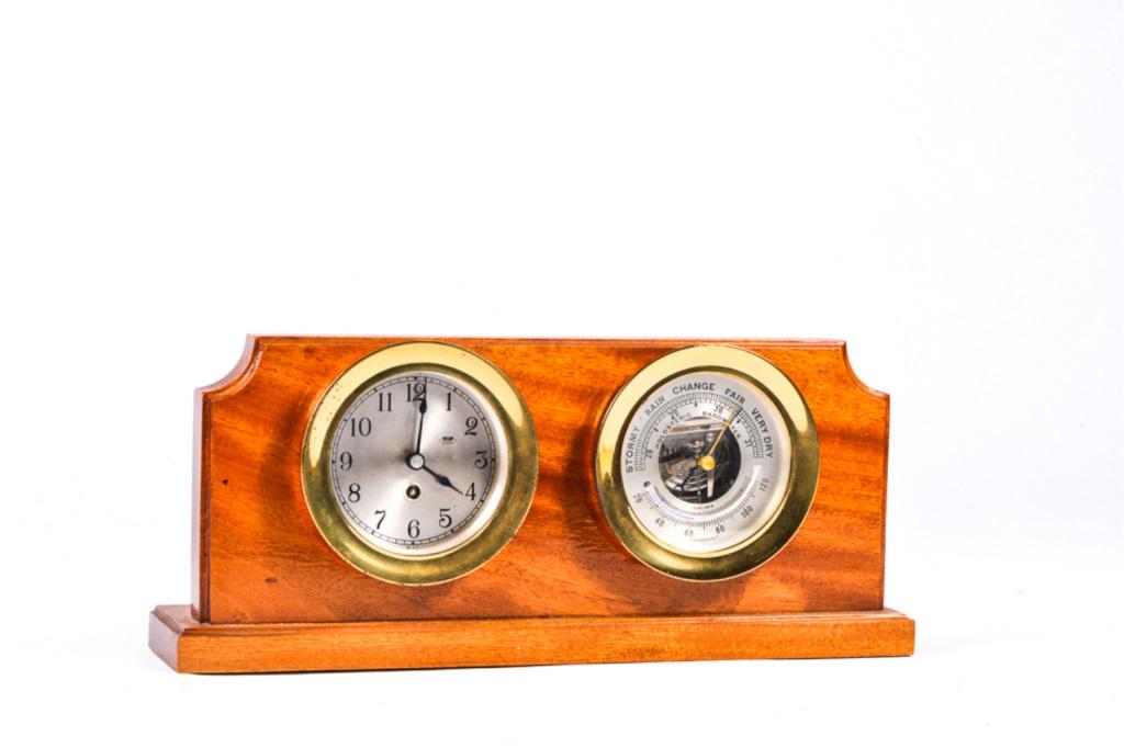CHELSEA BAROMETER AND CLOCK SET: CLOCK SET, clock and barometer w/themometer set in brass and mounted on wood base. Clock and barometer 5" in diameter overall. Clock is not running.