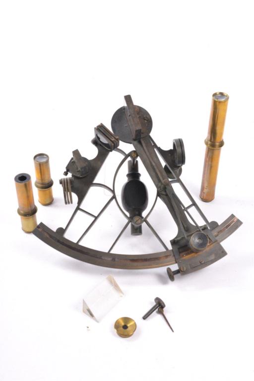 SPENCER, BROWNING & CO SEXTANT: Made of brass with silver scales and engraved in script on the limb "Spencer Browning & Co London". This sextant is 9 1/2" tall overall, with vernier magnifier, 3 round sun filters and 4 colored index