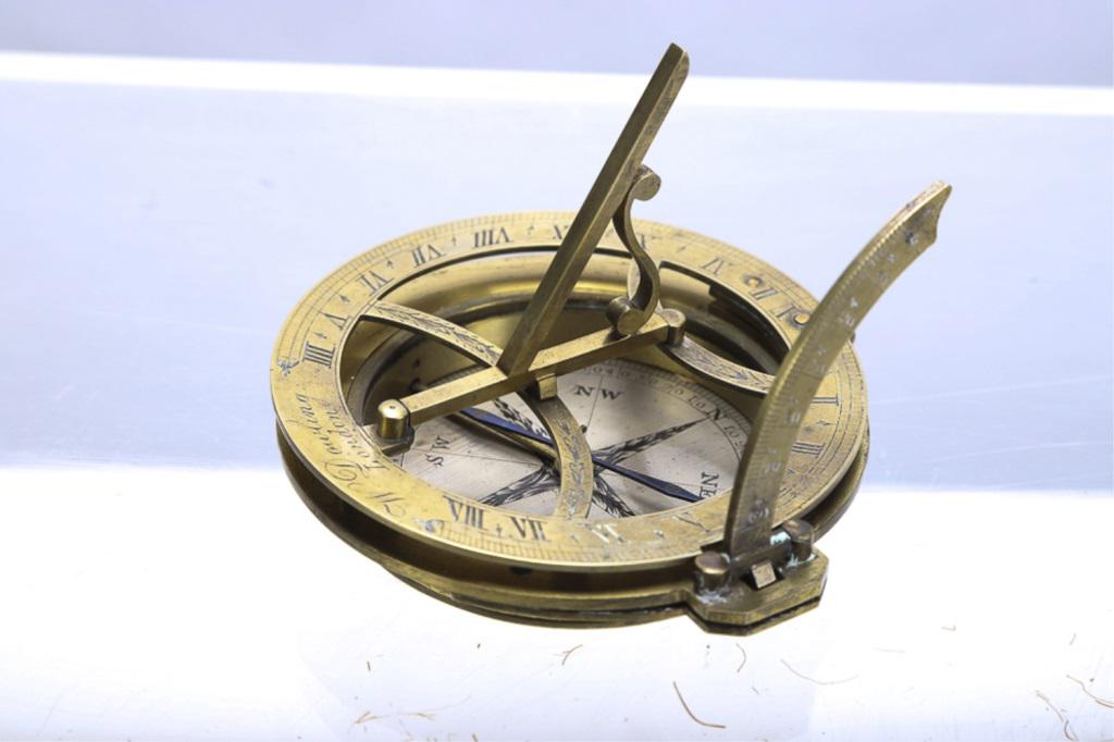 "W. DOWLING - LONDON" EARLY BRASS DIAL: Equinoctial Dial. Signed "W. DOWLING - LONDON". Diameter of the chapter ring 3 1/2". Latitude arc divided 0 to 90o, 2 1/2" compass Silvered compass dial, having a locking needle, a brass hour ring wit