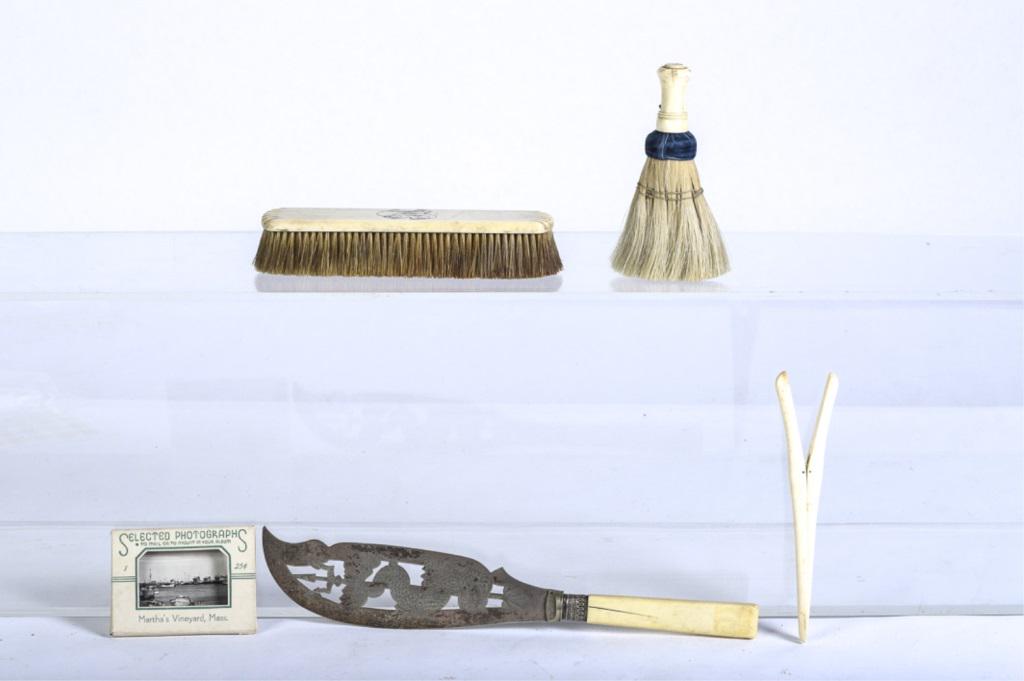 MISC. LOT OF 19th c BONE ITEMS: ITEMS. 1) Clothes brush with bone handle. 2) Glove stretcher made of bone, 3) Clothes brush with monogram. 4) 19th c fish serving knife with cut-out engraved blade, dolphin and trident. 5) Souvenir ph
