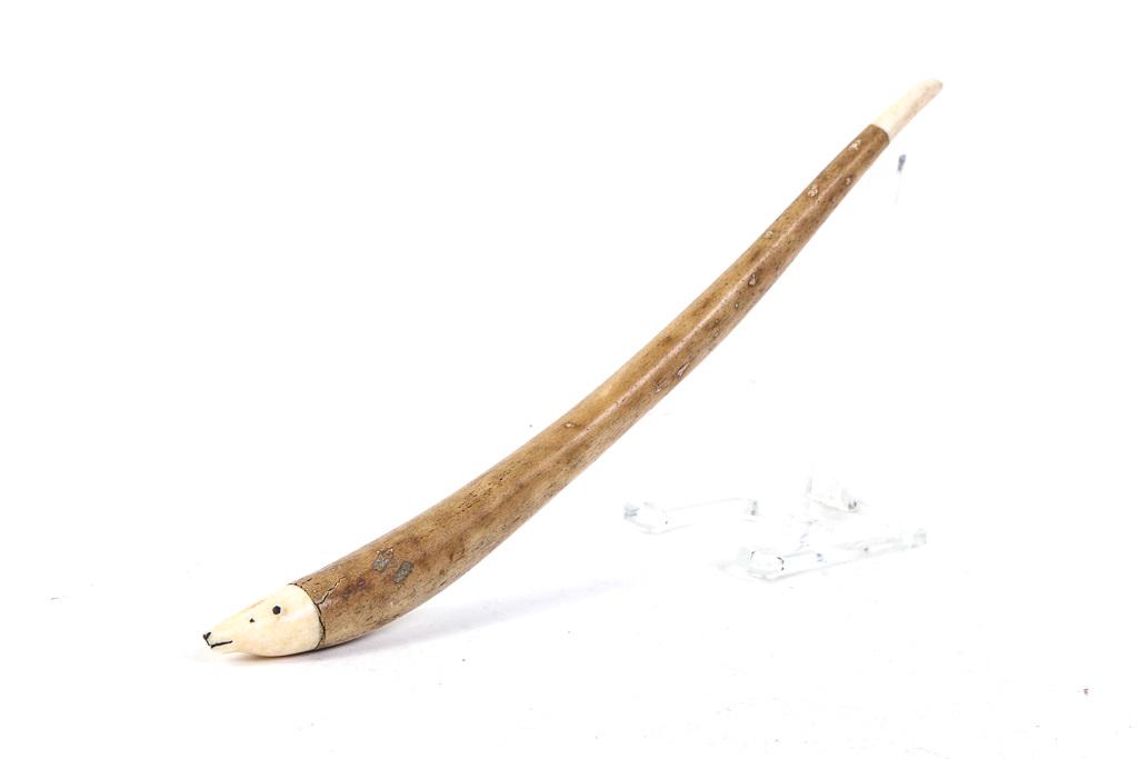 ESKIMO / INUIT DECORATED WALRUS BACULUM OOSIK: With a finely carved polar bear face and tale. 14 1/2 inches.
