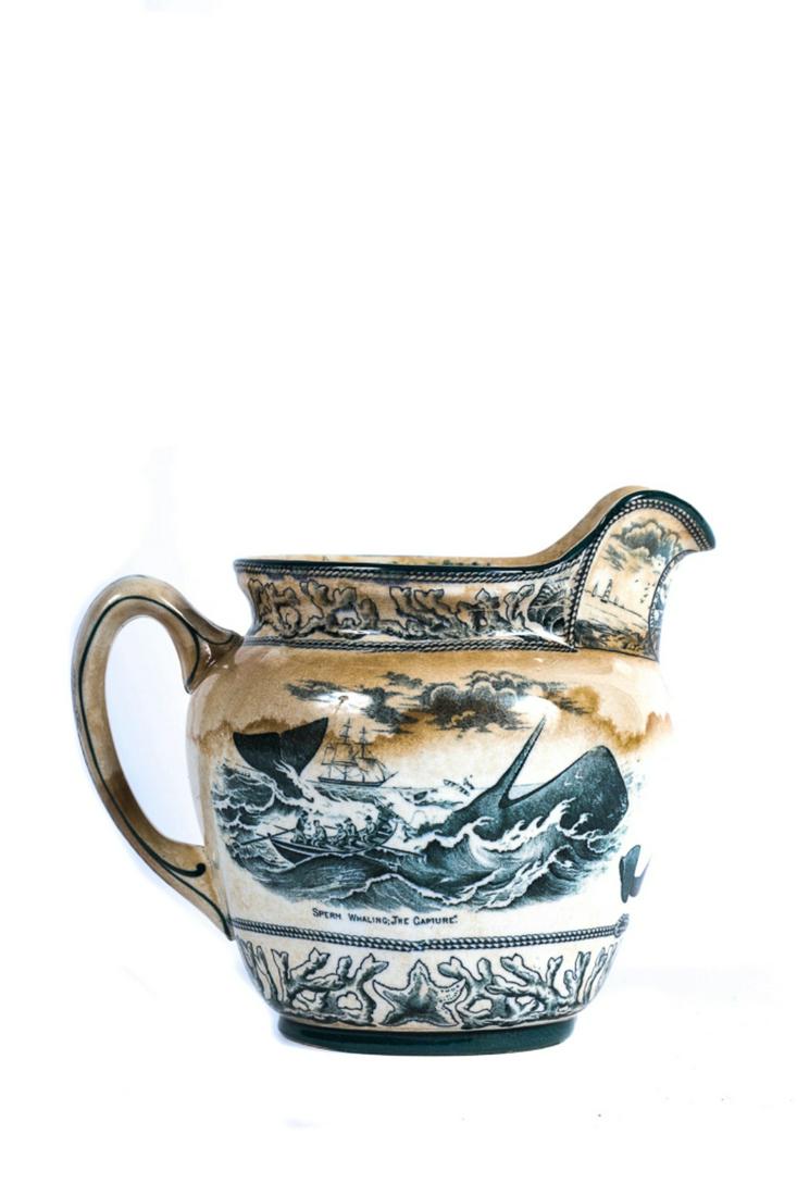 BUFFALO POTTERY PITCHER W/ WHALING SCENE: Souvenir Whaling City New Bedford. Whaling scene, whale ship NIGER, lighthouse etc. Pitcher is made by Buffalo and dated 1907. 6" tall. Staining, otherwise in fine condition.