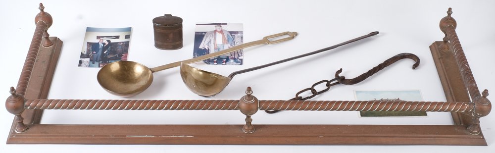 HAMMERSMITH FARM KEEPSAKES and PHOTOGRAPHS: Brass and iron ladles, fender, wrought iron hook, chain segment, and a brass and copper match holder, (2) color photographs of Yasha and women standing before fireplace with brass ladle and other fire
