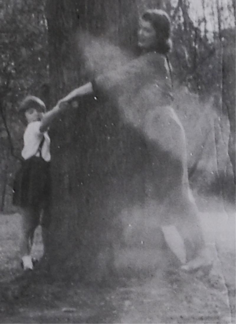 JACKIE BOUVIER and SISTER JANET HUGGING TREE: Most likely taken at "Merrywood" c.1949. photograph 3 x 3 inches. This photograph is unpublished. Provenance: Hammersmith Farm, Newport, Rhode Island