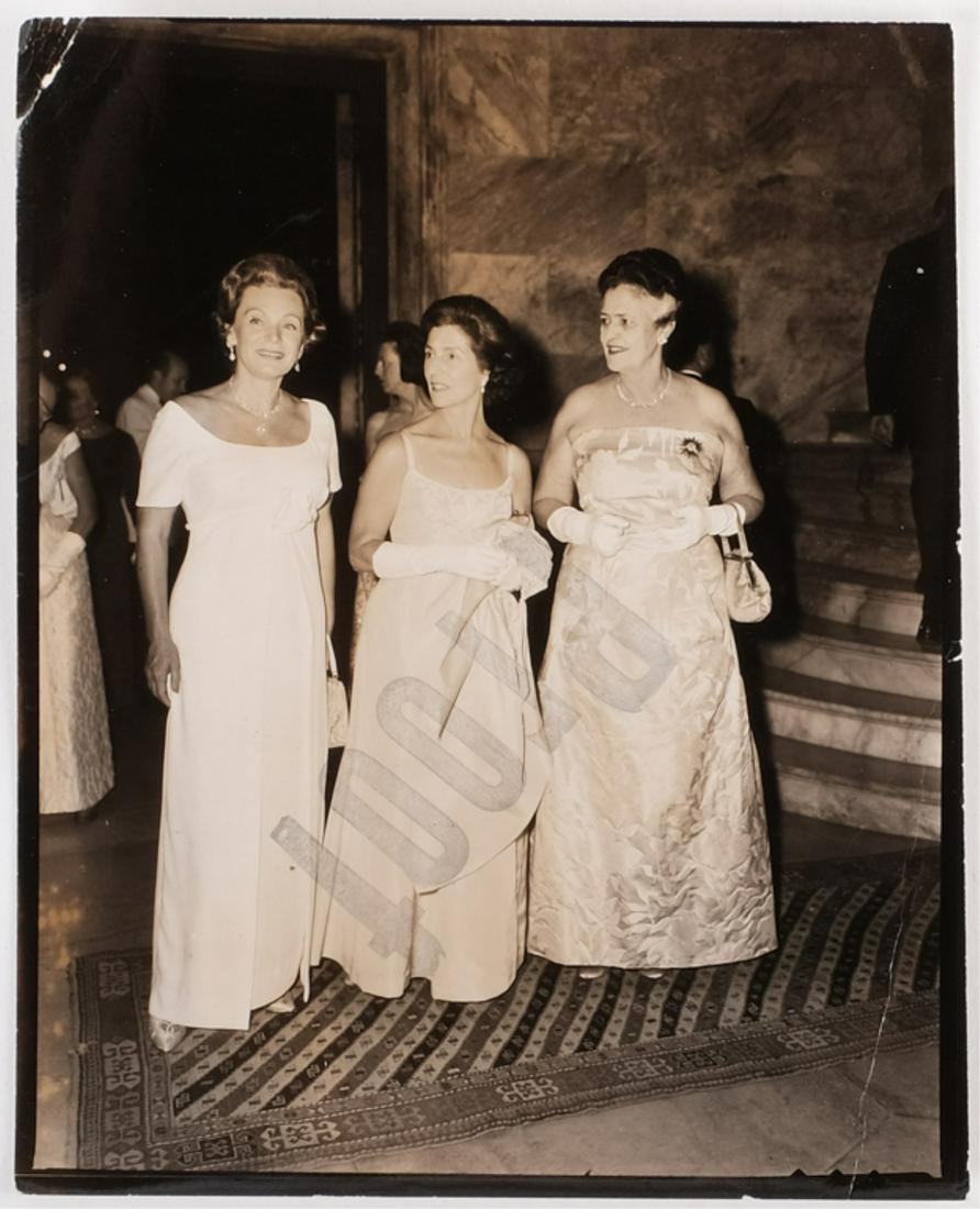 ELIZABETH ARDEN INTERNATIONAL BALL at MARBLE HOUSE: Janet Lee Bouvier Auchincloss with Jane Pickens to her right at the Vanderbilts marble house in Newport, RI by Burt and Richard Morgan New York. black and white contact proof. 5 x 4 inches.Provenance: