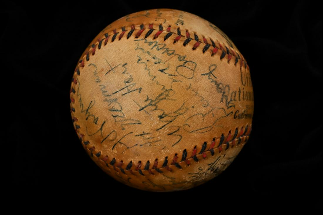 1934 PITTSBURGH PIRATES MULTI-SIGNED BASEBALL: Spalding Official National League baseball with blue and red stitching and (19) Pittsburgh Pirates signatures (7) of which being Hall of Fame members including: Coach Honus Wagner (HOF), Waite Hoyt (H