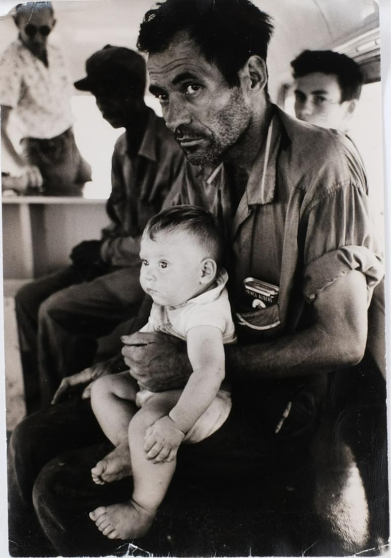 TASK FORCE / WAR AGAINST POVERTY 1964 PHOTOGRAPH: Migrant Worker & Baby on Bus by Steve Schapiro from Back Star photographic print 13 1/2 x 9 inches. Note: In 1964 Deirdre Henderson was in charge of state poverty initiatives under President Johnson a