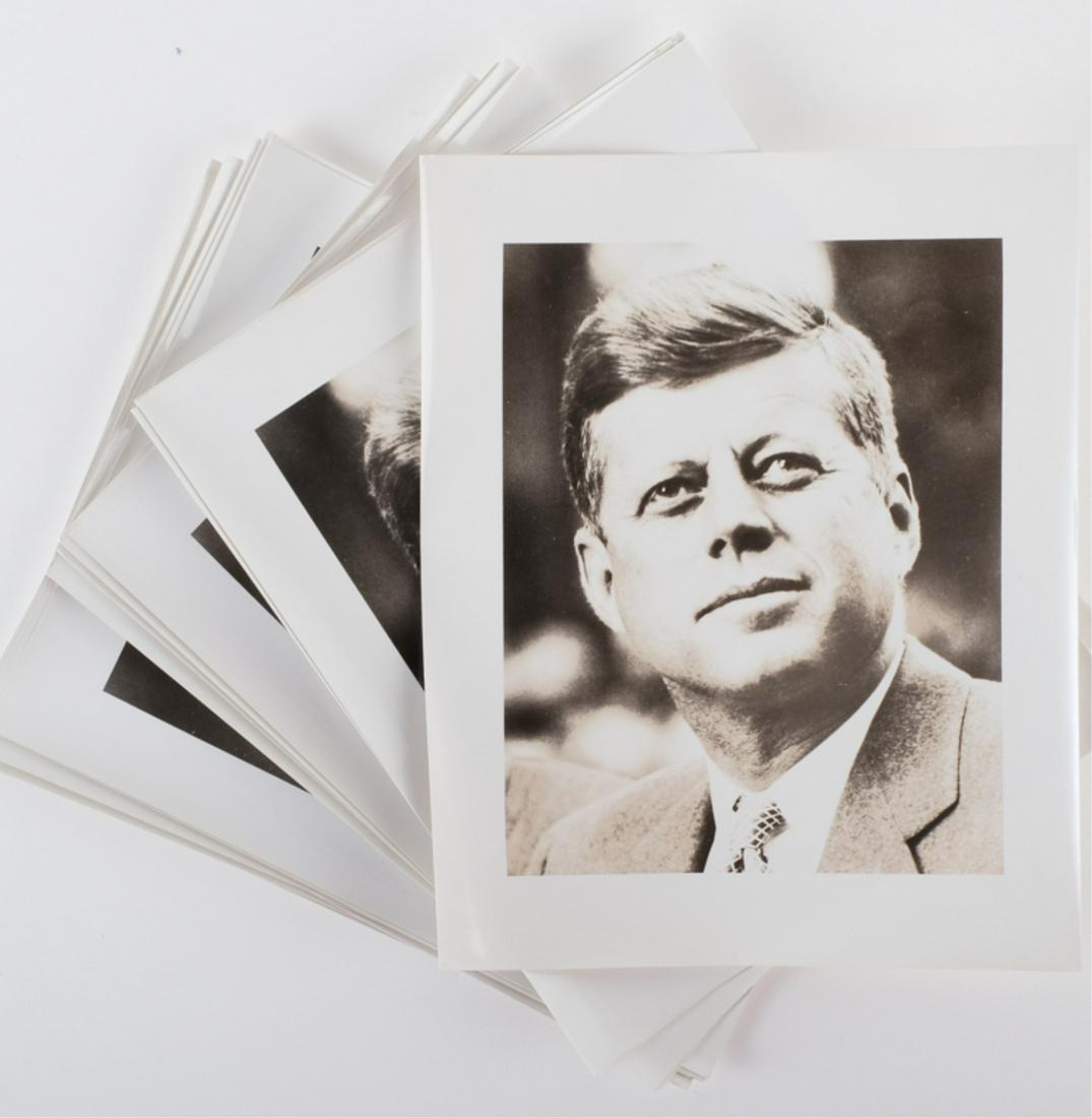 (34) PHOTOS OF JOHN F. KENNDY, JACKIE & FAMILY: Including: (23) Portraits of J.F.K., (10) Portraits of Jackie signed in print and (1) Group photo of the Kennedy family. 8 x 10 inches black and white photographs. Together with their original mailing