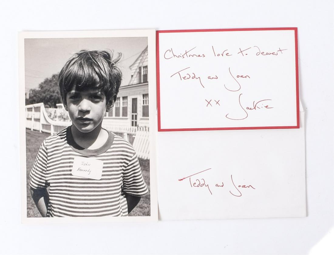 JOHN JOHN KENNEDY PHOTO & JACKIE SIGNED NOTE: John Kennedy 7 x 5 inch black and white photograph by Cecil Stoughton and a Christmas Greeting to "dearest Teddy and Joan" signed xx Jackie.Provenance: Rosalie Helm, assistant and friend to Senator Te