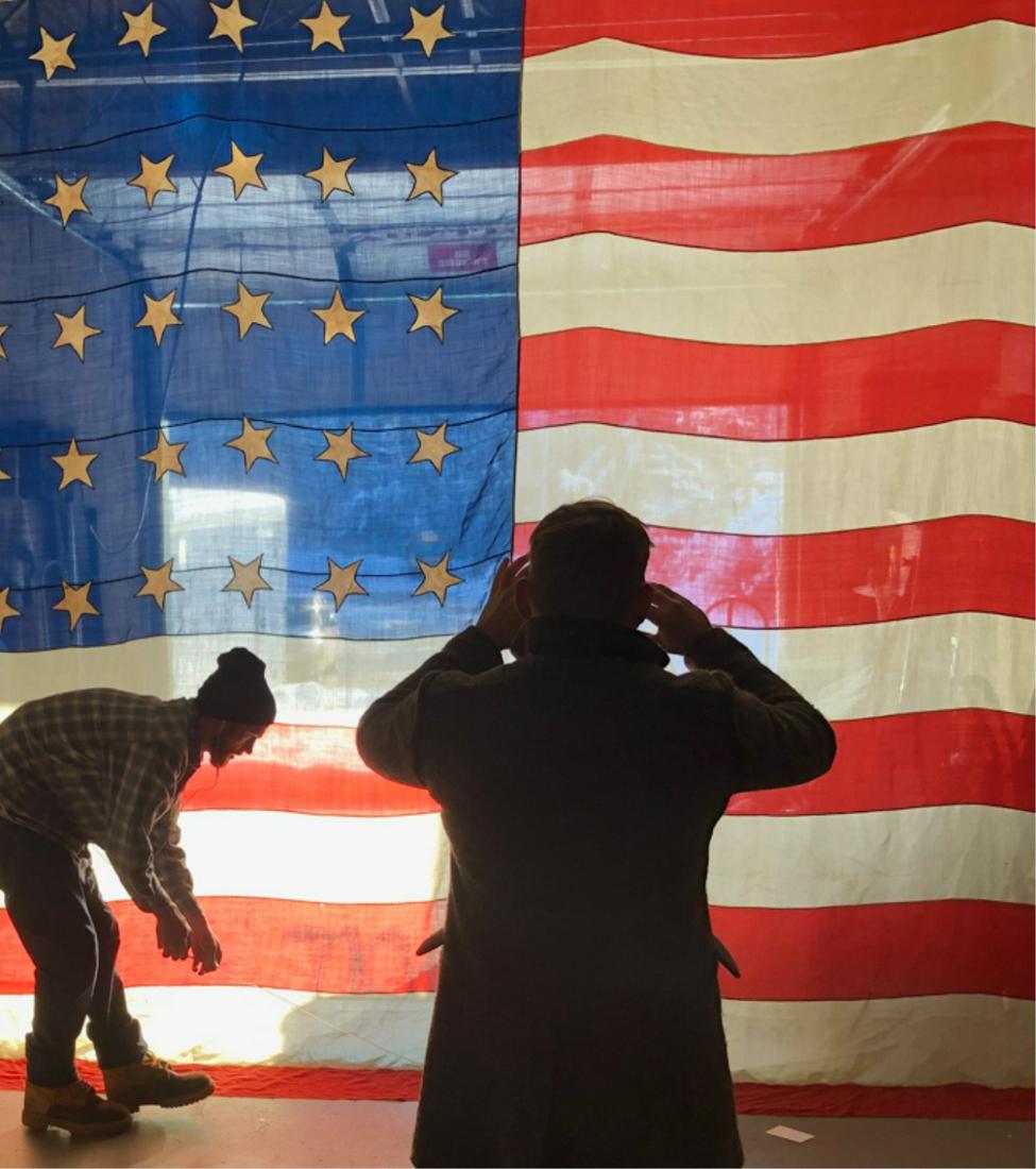 HUGE CIVIL WAR ERA (35) STAR AMERICAN FLAG: Each color hand stitched with blue field star cut with white stars sewn on (1) side. 12 x 17 feet. Embroidered L.H. and written Lucious Hotchkiss 238 Church St. on hoist.