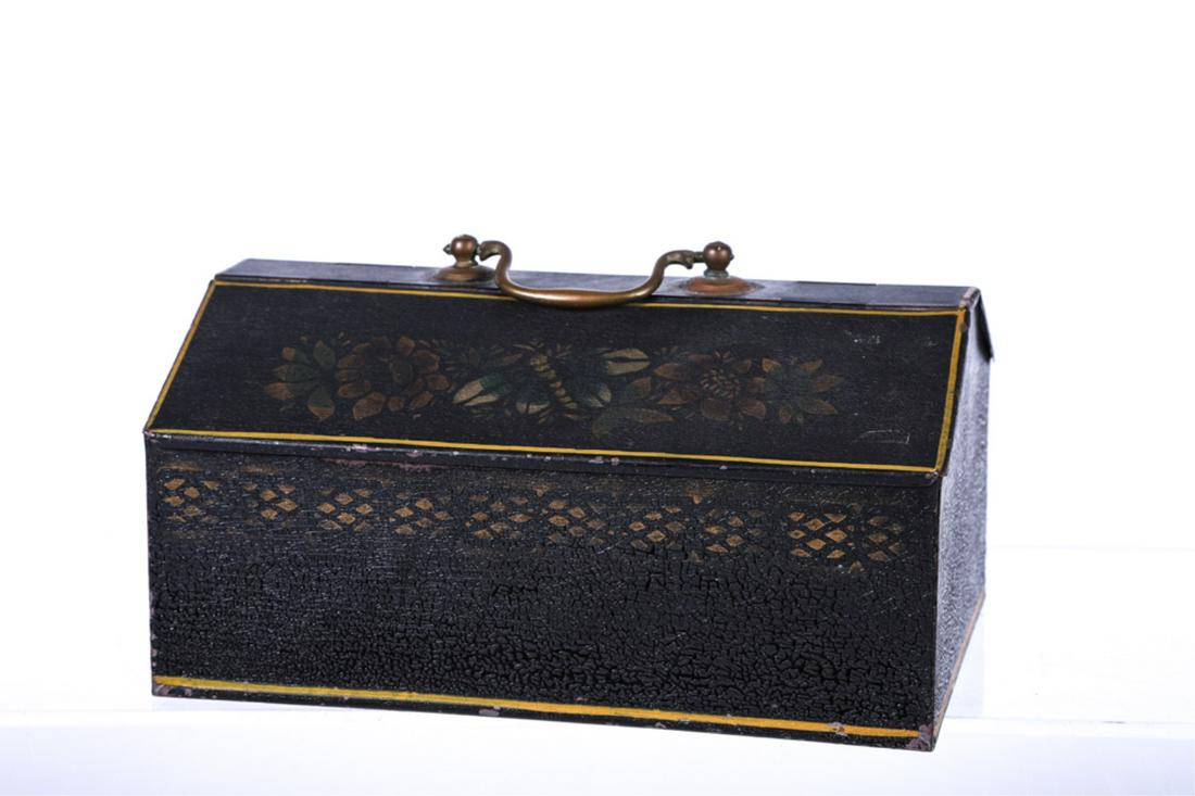 (19th c) TIN TOLEWARE SPICE BOX: Brass swing handle, (2) canted lids which hinge open to (6) compartments. Pleasing stenciled floral motif and running border. 5 x 9 x 6 inches.