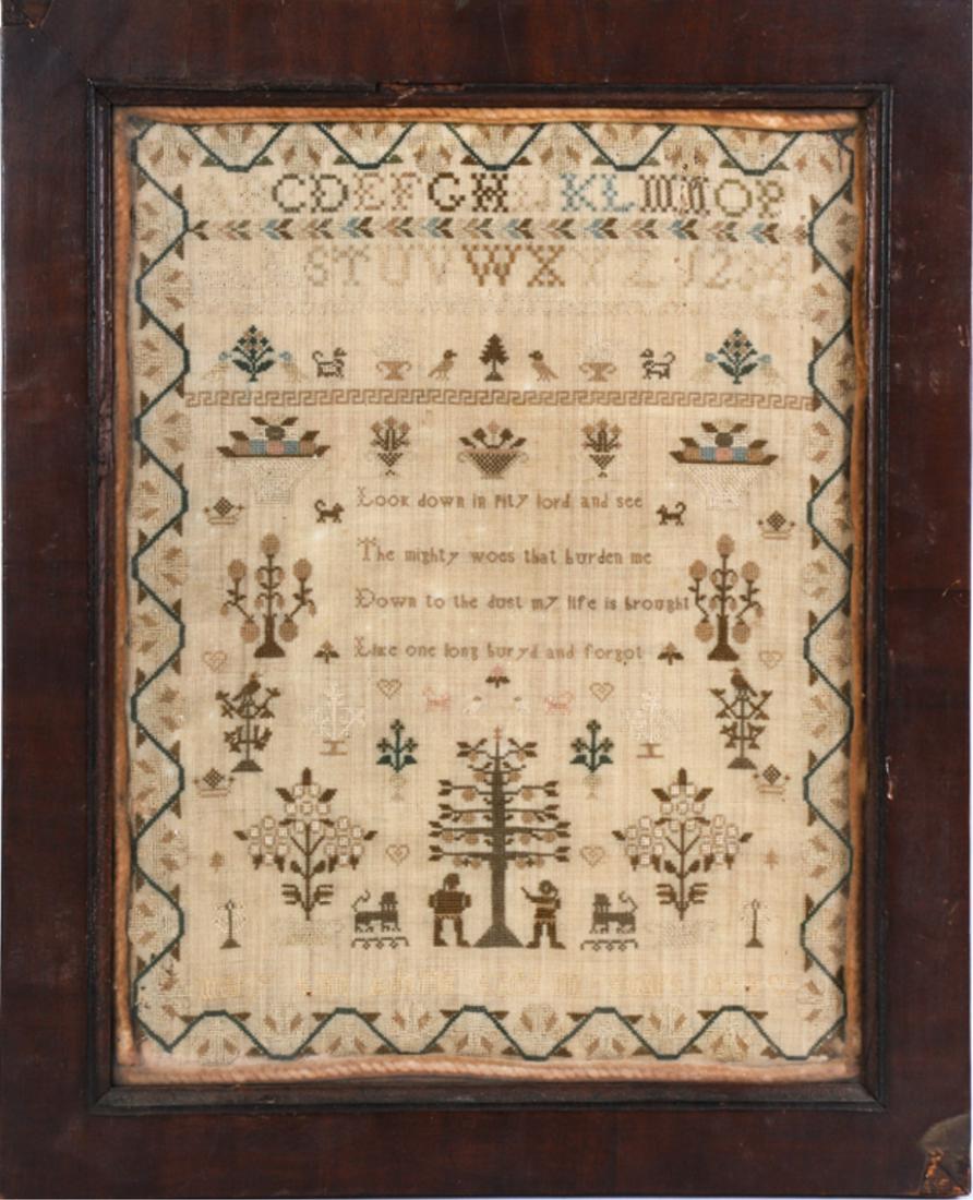 1824 SAMPLER BY MARY ANN ADAMS AGED 10: Alpha-numeric sampler with Bible verse, running floral border, trees, birds, dogs, baskets of fruit and Adam and Eve. 20 /2 x 17 inches (overall including frame)