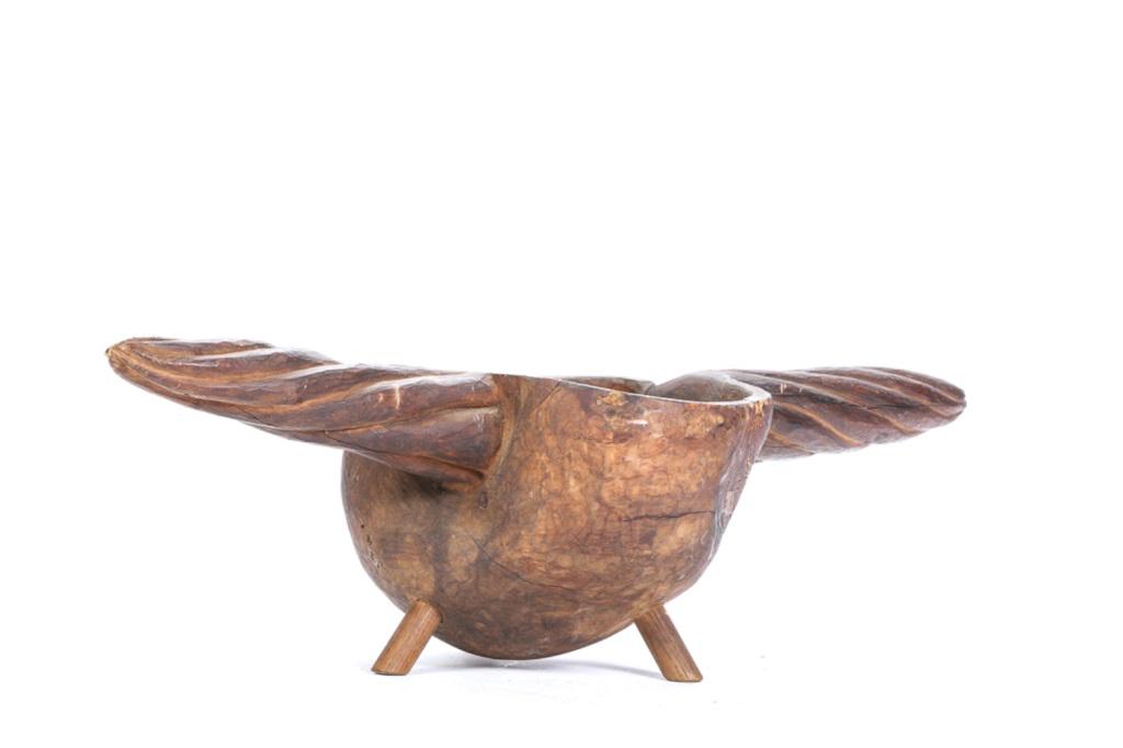 NATIVE AMERICAN WOODLAND BURL BOWL: Font and rope twist handles are carved from a single piece of wood and is supported by (3) legs that were added at a later date. Signed on bottom. 7 1/2 x 29 x 11 inches.