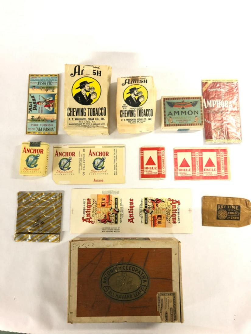 (12) PIECES TOBACCIANA ALI PASHA-ANY TIME: "Ali Pasha" Egyptian cigarettes pack advertising, (2) bags Amish "Honey Cured" Chewing Tobacco, Ammon Cigarette Box, Amphora Pipe Tobacco Pouch, Anchor "Special" 20 pack, Anchor unused "Special" pack 