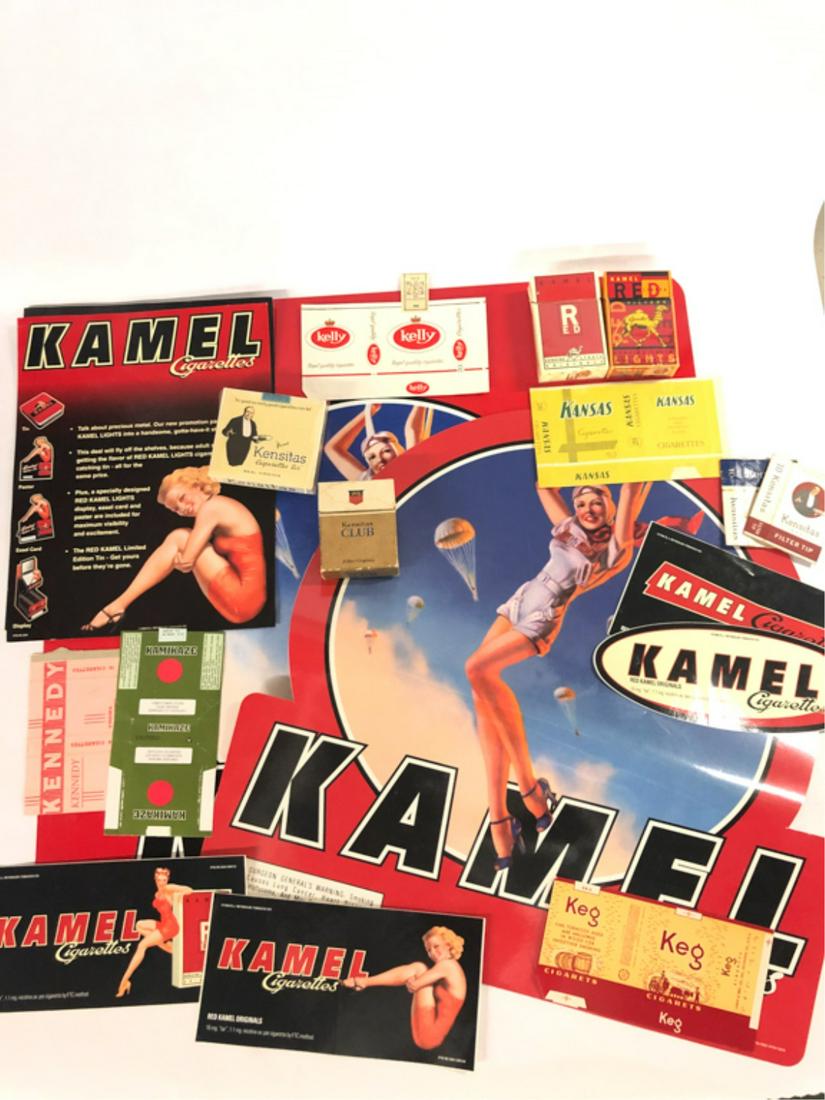 (24) PIECES TOBACCIANA KAMEL-KENSITAS: (4) Kamel Red hard packs, (3) Kamel Red Lights hard packs, (2) Kamel Cigarettes 1998 Presence Pieces catalog flyers, (4) Kamel Cigarettes bumber stickers dated 1998, Kamel Cigarettes wall sticker prom