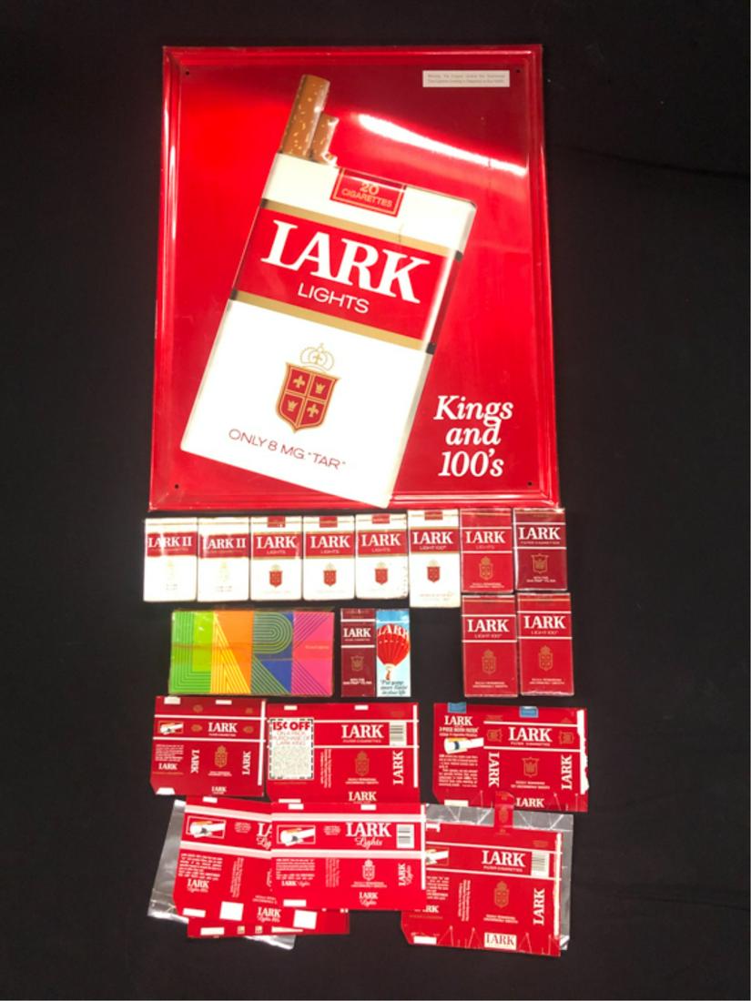 (25) PIECES TOBACCIANA LARK: Lark Lights Kings and 100's metal sign 21 1/2"x17 1/2", (2) Lark II soft packs, (2) Lark complimentary boxes, (3) Lark Lights soft packs, Lark Lights (red) soft pack, Lark Filter Cigarettes with gas-t