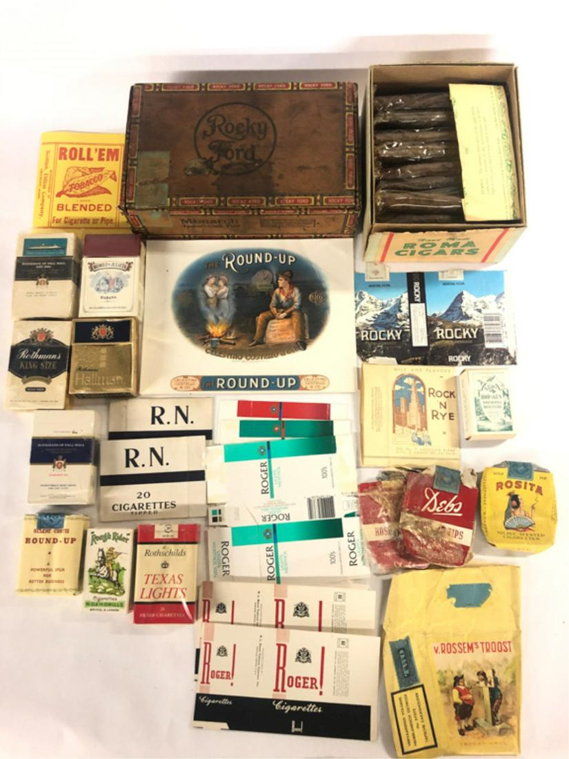 (50+) PIECES TOBACCIANA ROCK-ROUND UP: Rock 'N Rye American Blend packaging, Rocky soft pack label, Rocky Ford cigar box, Rod and gun Smoking mixture box, (3) Roger hard pack boxes, (2) Roger! Cigarettes soft pack labels, Roll 'Em Blended