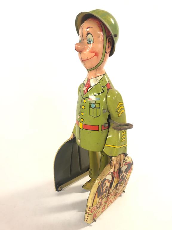 G.I. JOE AND THE K-9 PUPS WIND UP TOY: Tin litho wind up toy in working order w/ minor wear 8 3/4" tall From the collection of former FBI agent Bill Rosenbaum Condition: See photos Temp No 436