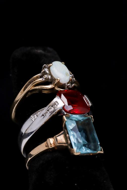 (3) 10k GOLD RINGS SET with STONES: Including: Opal, garnet with accents and an aqua marine. 5.0 dwt
