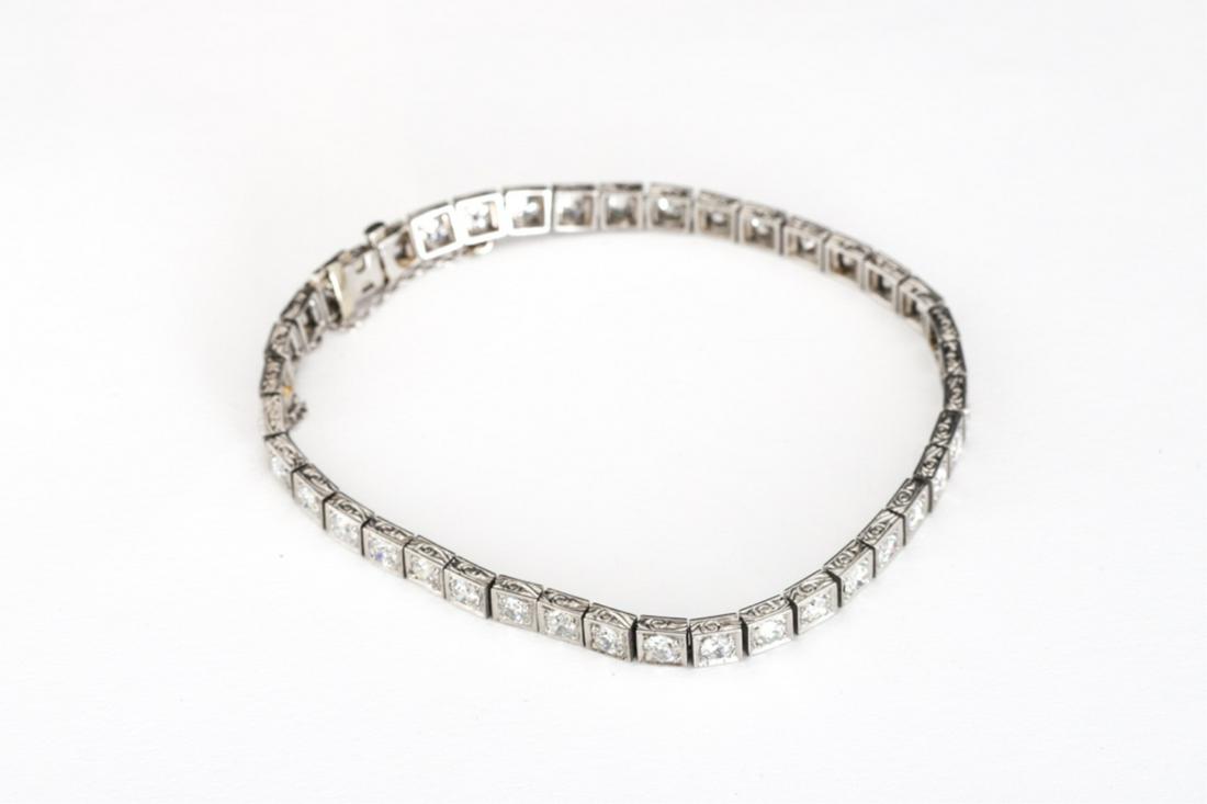 PLATINUM DIAMOND ART DECO TENNIS BRACELET: Vintage from Art Deco period, 7 3/8 inches long. approx 4.35 ct twt. 12.6 dwt.40 diamonds SI1/SI2 H-1 color at .1 diameter totaling 4cts.