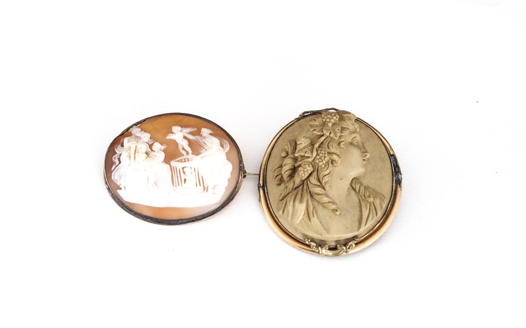 NICELY CARVED LAVA CAMEO: with another shell cameo in sterling frame, lava in a gold filled frame. Lava approx 2 x 1 1/2 inches.