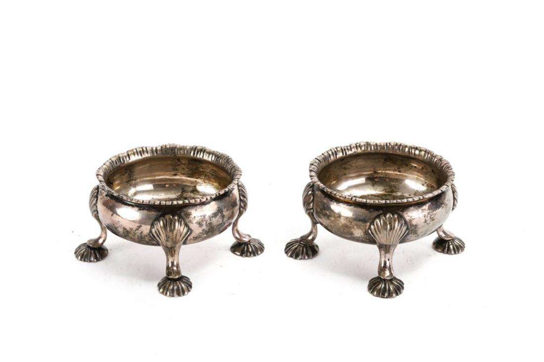 IMPRESSIVE PAIR OF OF EARLY SILVER MASTER SALTS: Rococo rim and oval font raised high on feet with scallops. marked H.D. ? 1 3/4 x 3 1/4 x 3 1/4 inches. 6 troy ounces