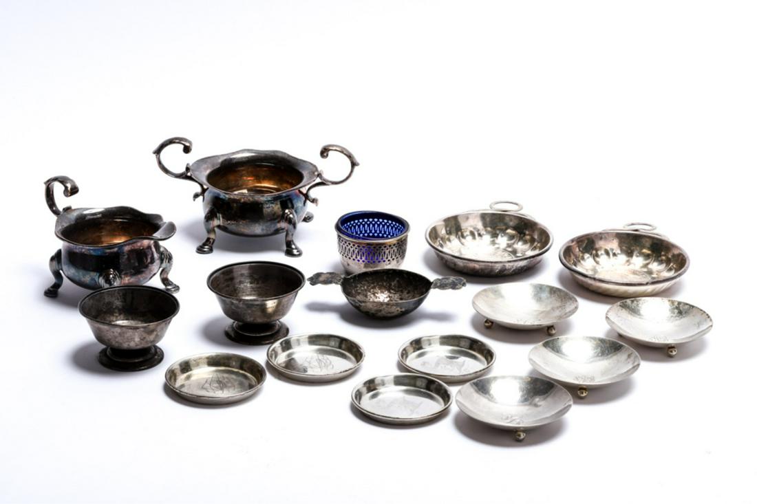 LOT OF STERLING, COIN and SILVER PLATED HOLLOWARES: Including: (4) Sterling silver salts by Wheelock, (4) Whiting coasters, salt with cobalt glass insert, pair of unmarked wine tastevins, double handled tastevin and a silver plated creamer and sugar. 1