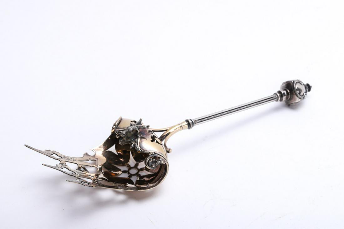 IMPORTANT GEORGE SHARP STERLING SERVING PIECE: Made for Brown and Spaulding, Philadelphia. Elaborate large reticulated forked scoop, decorated with a goats head. 11 inches. approx 4.54 ozt