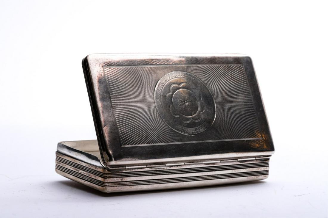 BRITISH STERLING SILVER CIGARETTE BOX: Convex hinged lid and base engraved with floret, rays and stripes. 1 x 5 x 3 inches. 5.95 troy inches