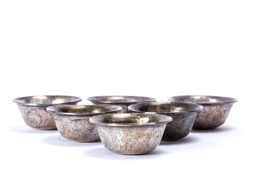 (6) SILVER TIBETAN BUDDHIST RITUAL OFFERING BOWLS: Engraved with floral and medallion motifs. unmarked. 6.4 troy ounces.